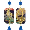 Orecchini Viso E Fiore Blu